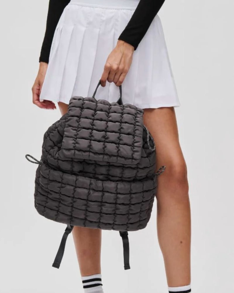 Back of a model wearing a size O/S All Star Backpack In Carbon in Carbon by SOL and SELENE. | dia_product_style_image_id:351608